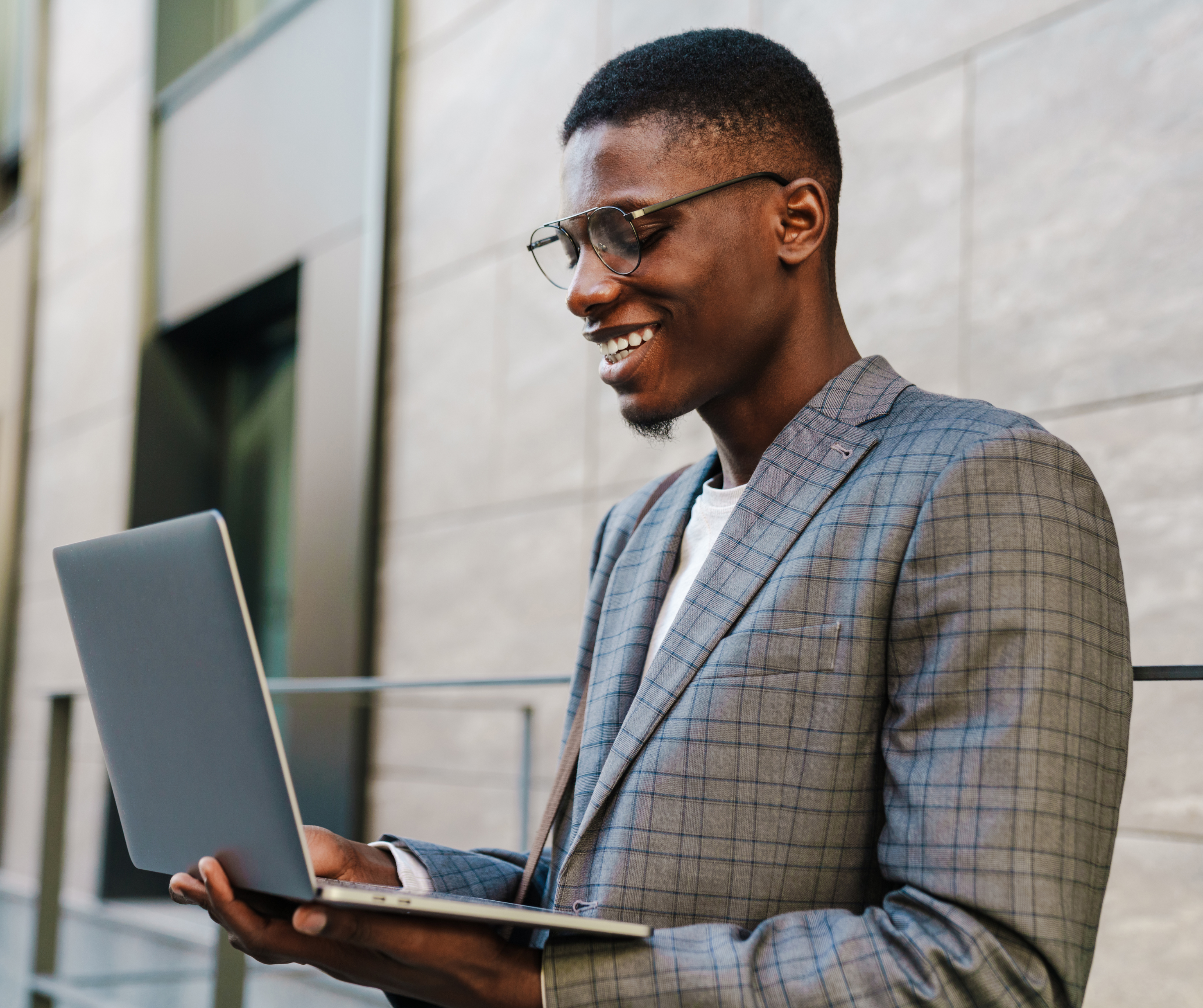 A young Batswana male entrepreneur working on laptop.