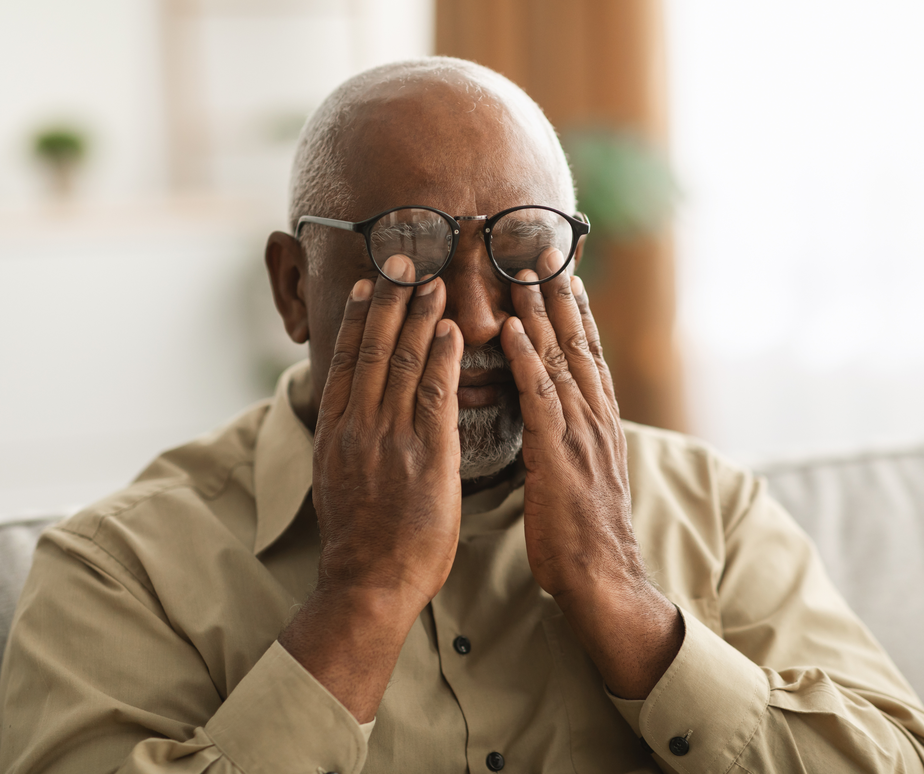 Elderly Batswana male worried about the future.