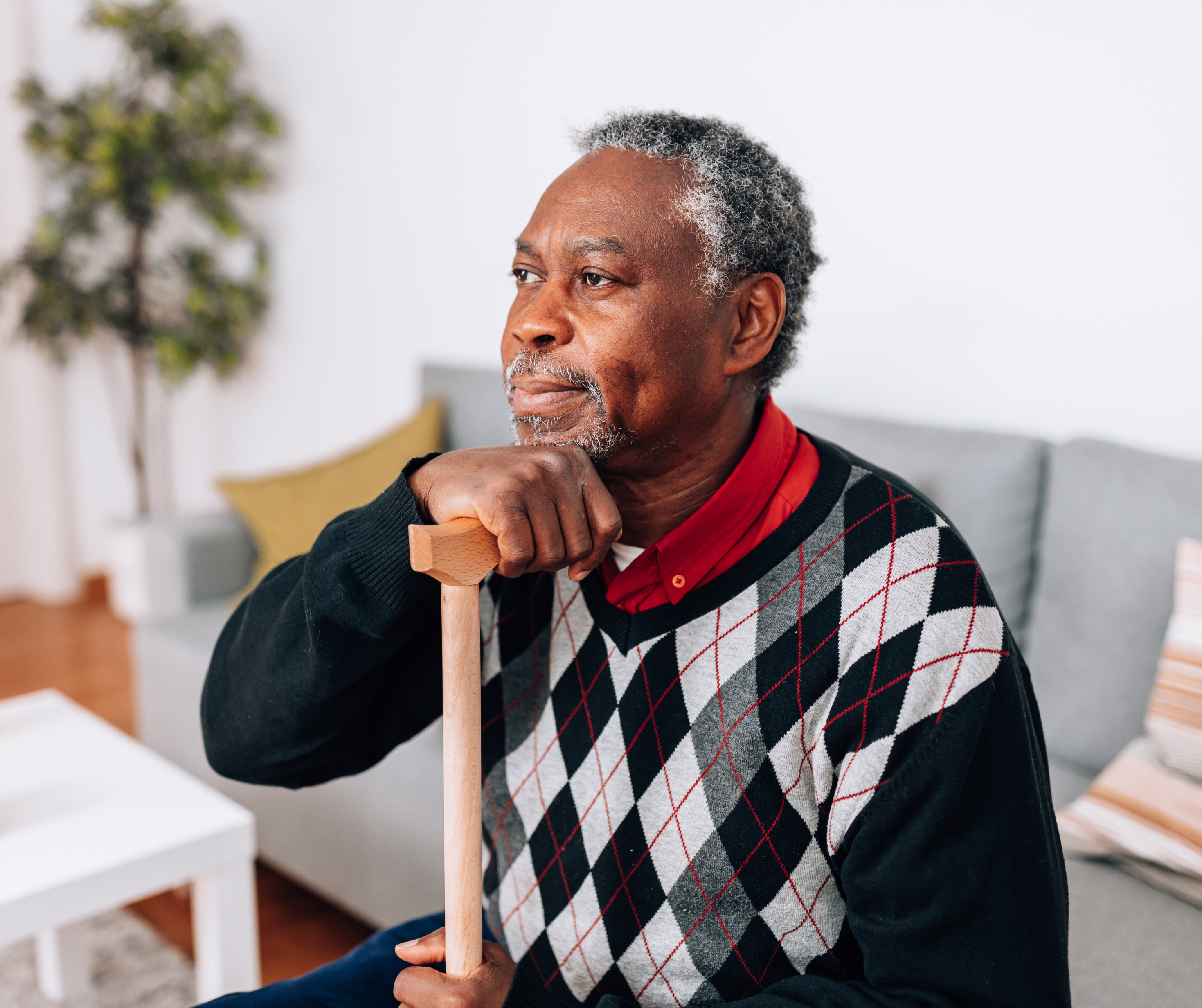 Elderly Batswana man pondering.