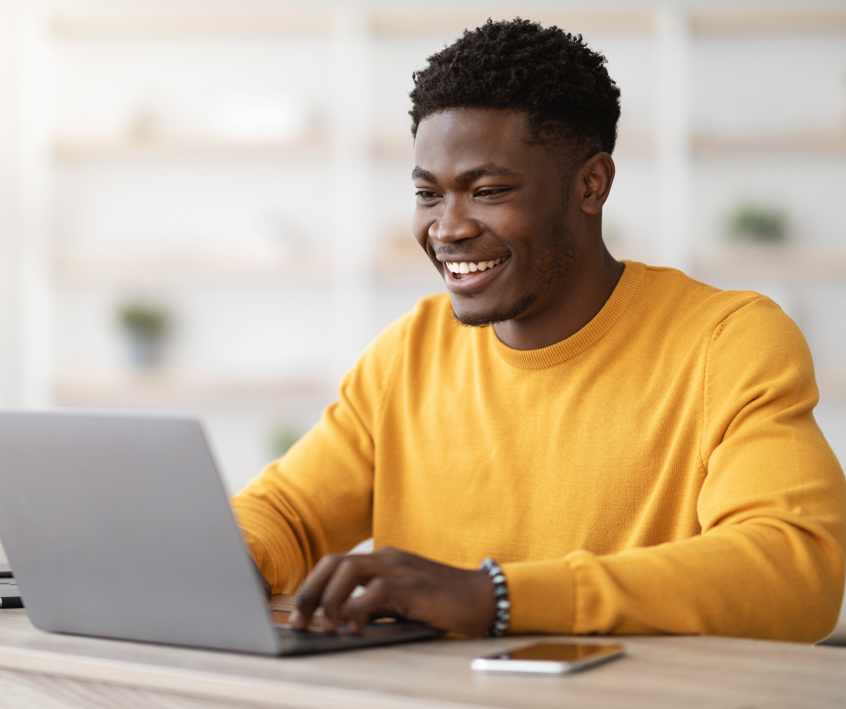 Batswana man working on his laptop.