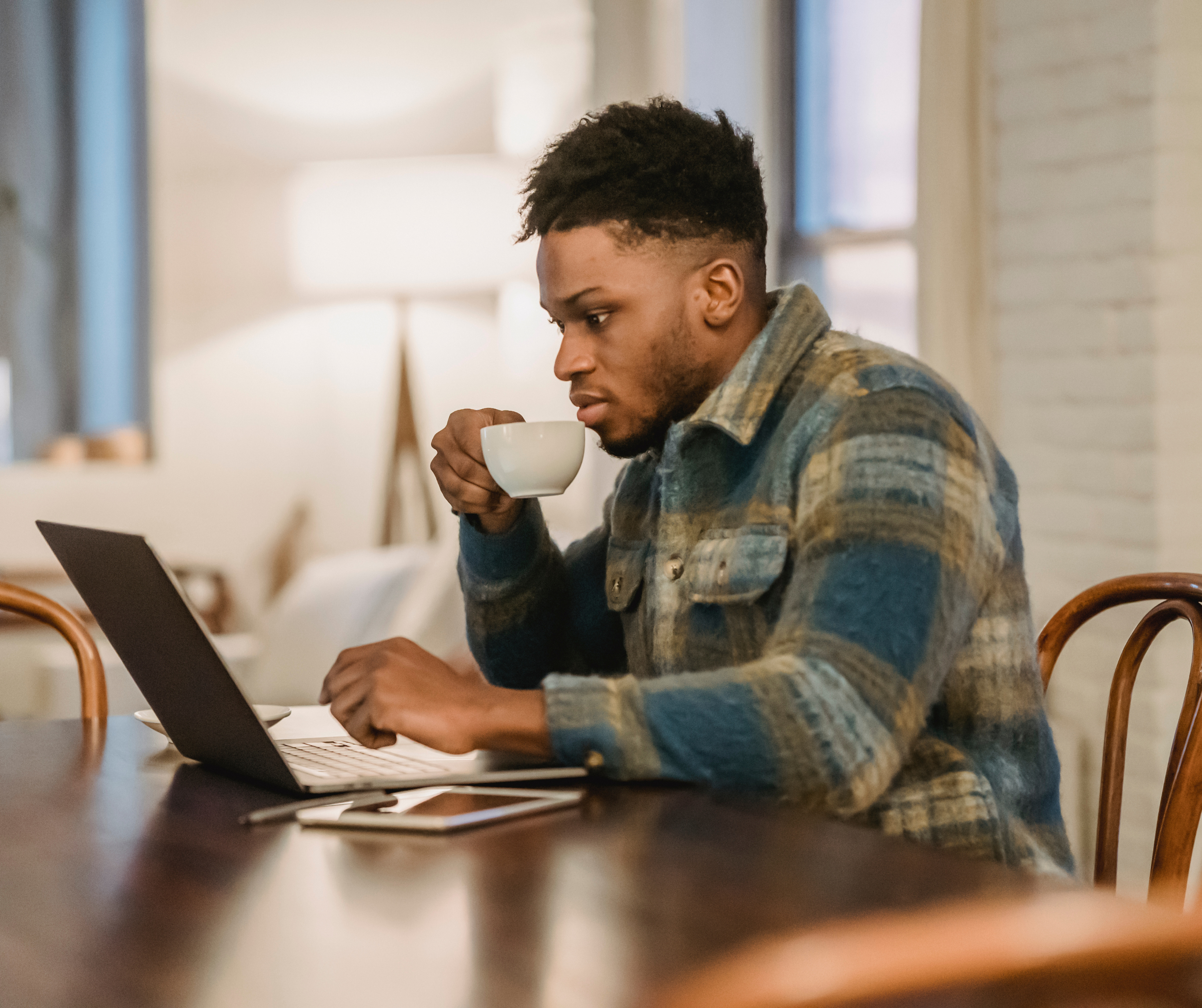 Young Batswana man working in a café.