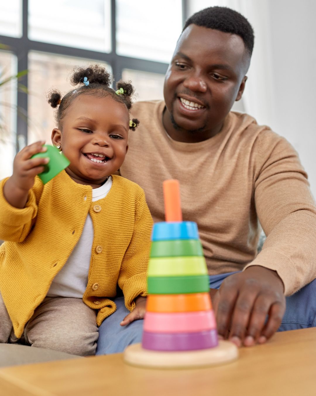 Father playing with toddler