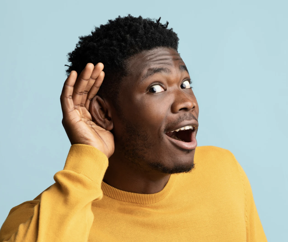 Young Batswana man listening for answers.
