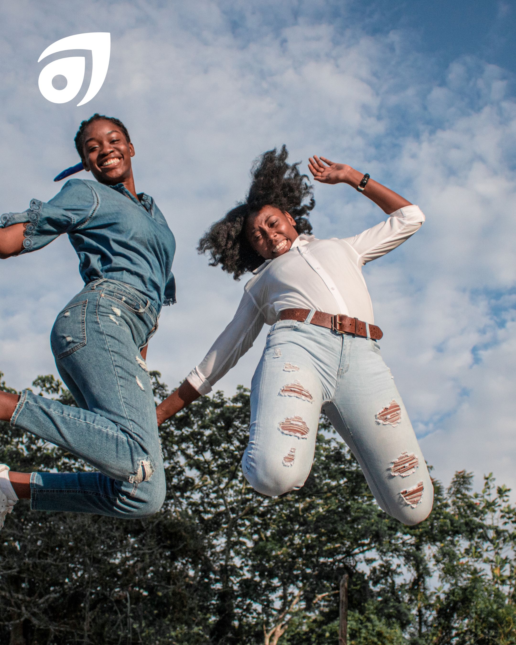 Two women jumping in the air