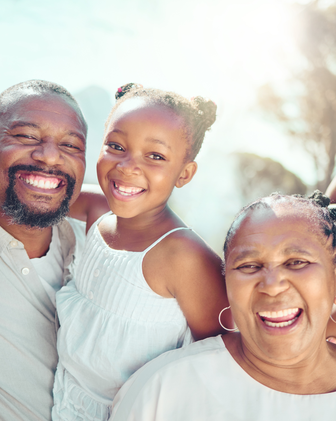 Family smiling outdoors