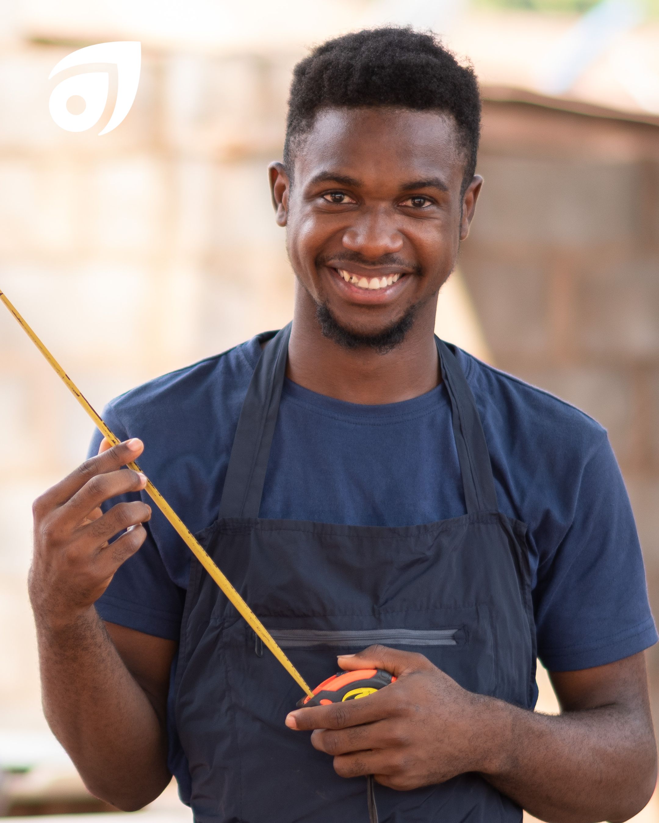 Male carpenter using tape measure