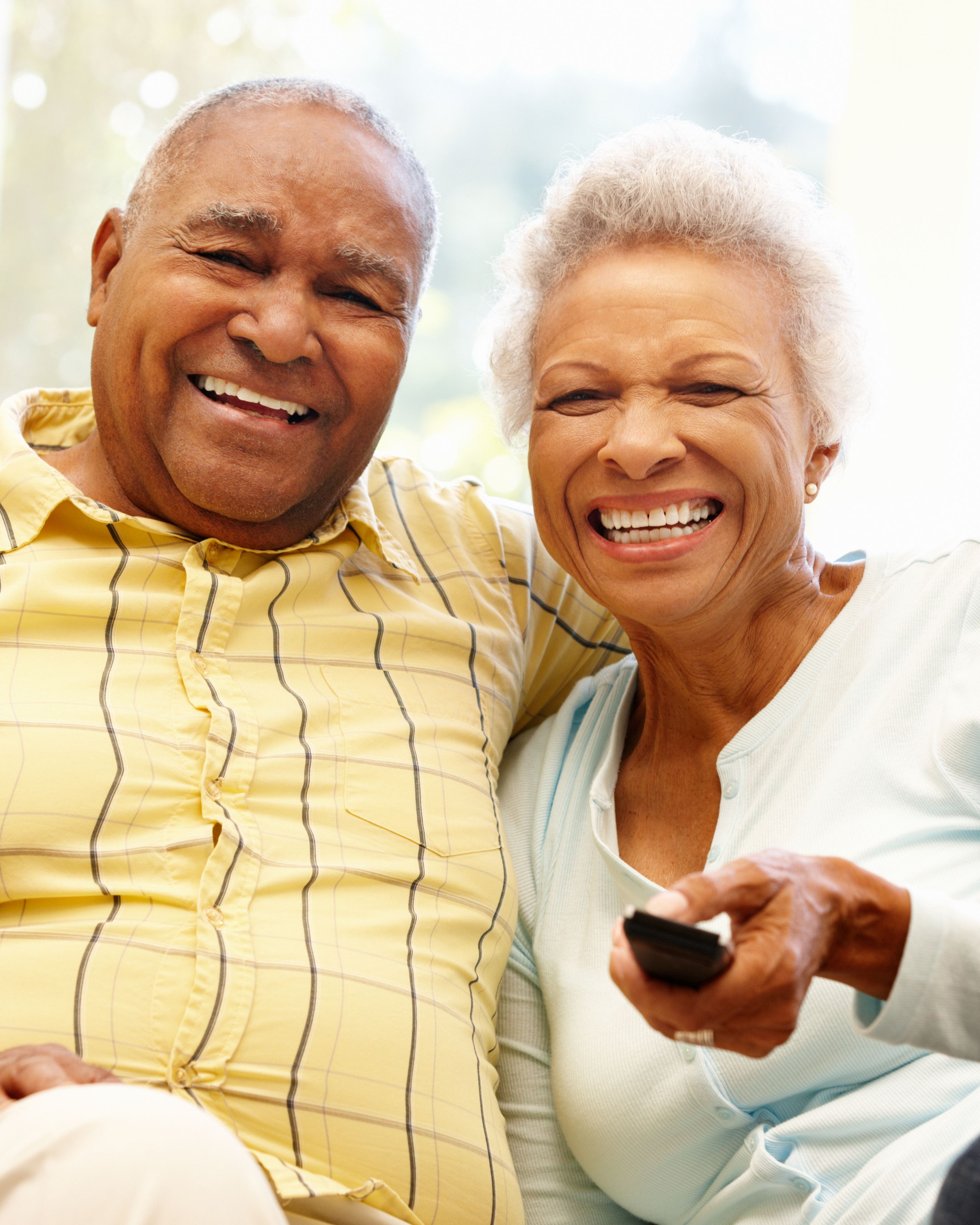 Elderly couple watching TV