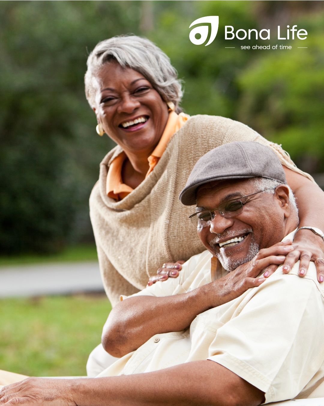 African couple outside on chair happy