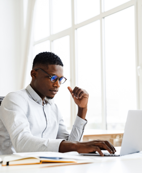 Bantwana man working at office desk.