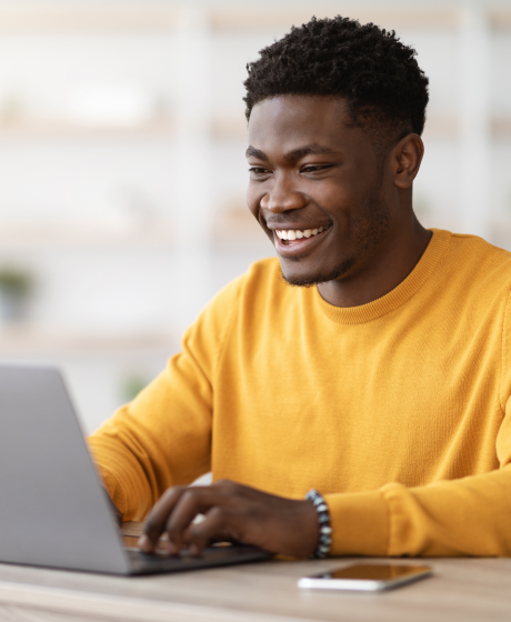 Batswana man working on his laptop.