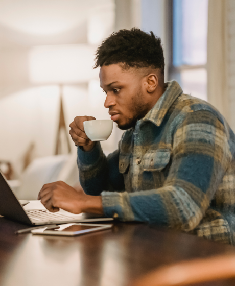 Young Batswana man working in a café.