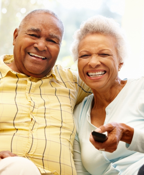 Elderly couple watching TV